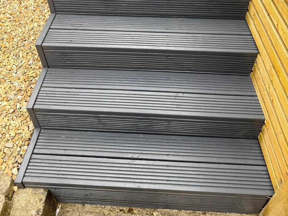 deck installation gray composite decking steps closeup swansea daffodil decor
