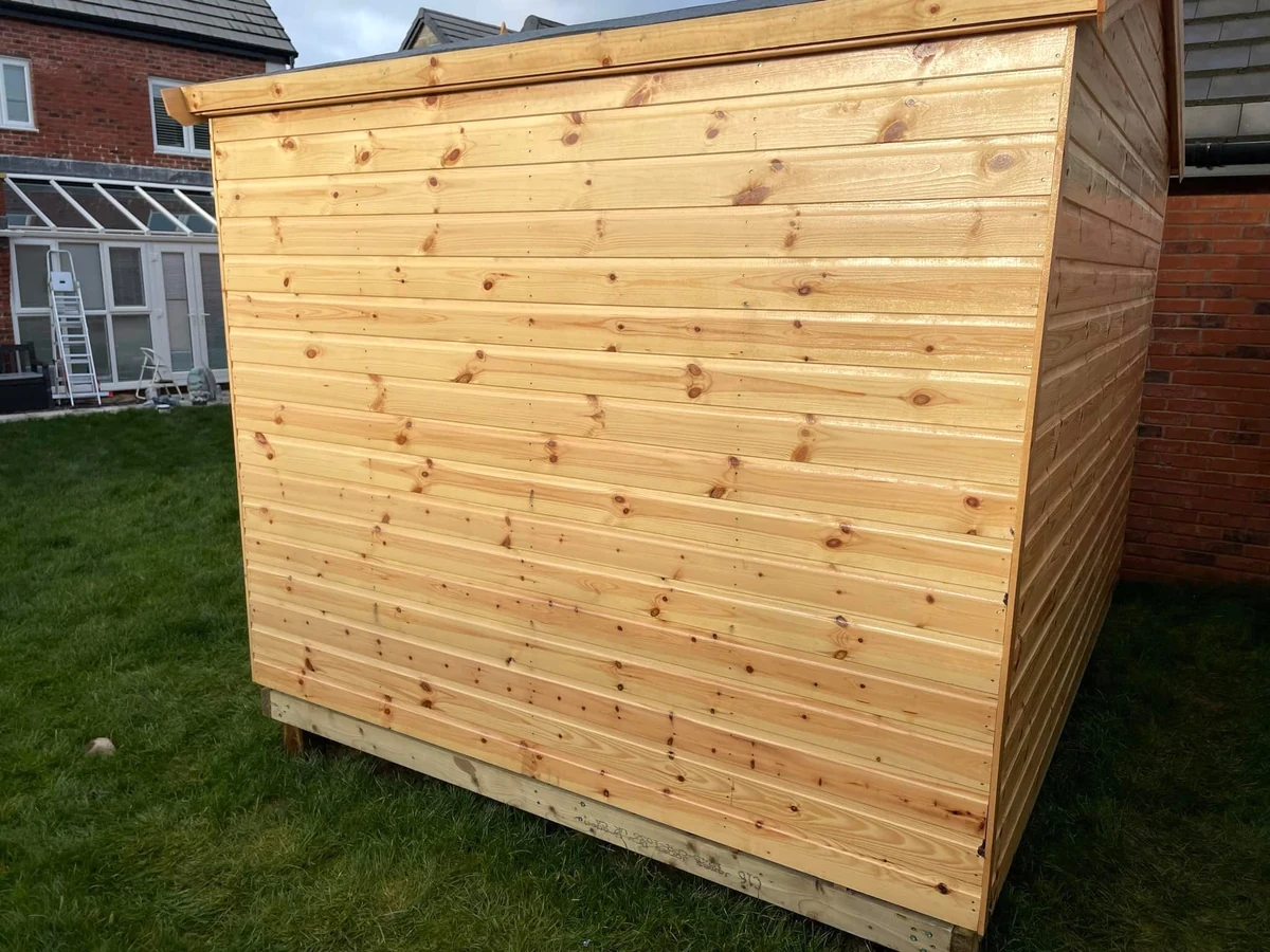 fireplace-tiled-swansea-marble-daffodil-tiling exterior painting new wooden garden shed swansea daffodil decor 1