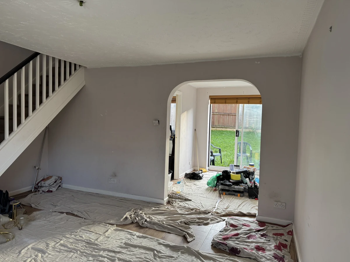 Living room painted with an archway and garden doors after an extension in Swansea