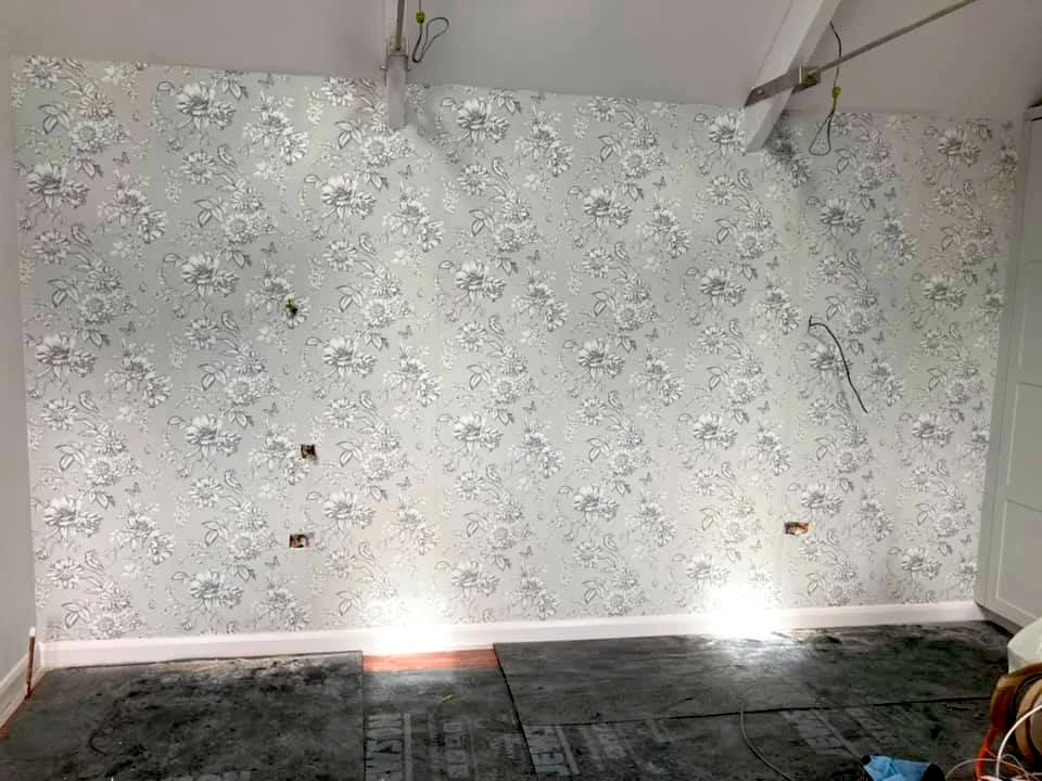 wallpapering floral pattern feature wall in progress swansea daffodil decor