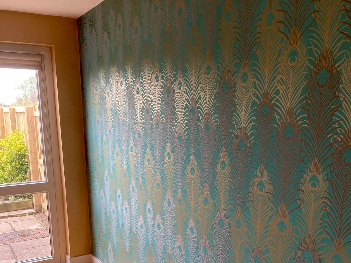 wallpapering turquoise palm leaf feature wall living room swansea daffodil decor